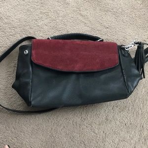 Cute maroon suede and black satchel. Convertible